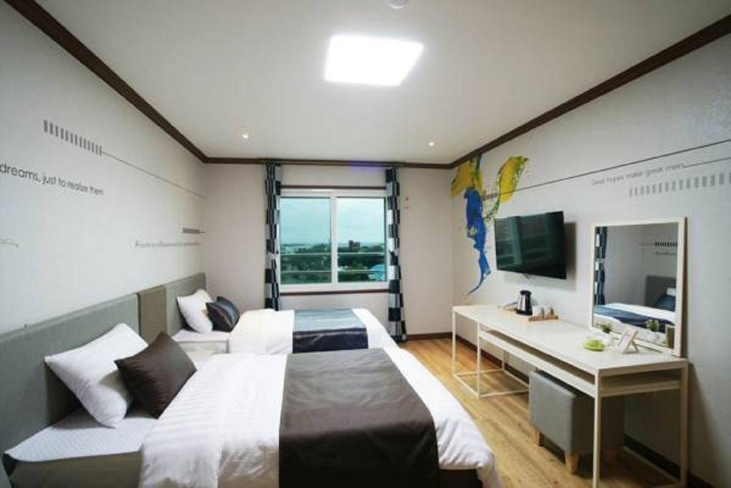Seongsan Aqua Beach Hotel Seogwipo Rum bild