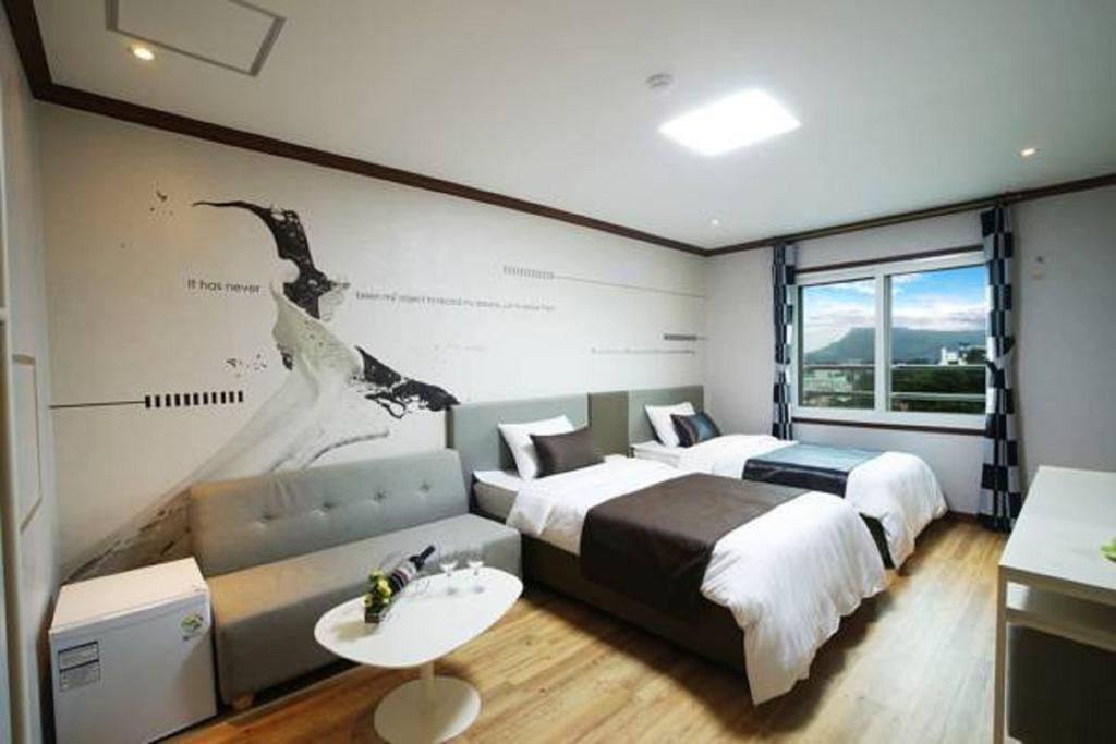 Seongsan Aqua Beach Hotel Seogwipo Rum bild
